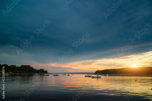 Boat at sunset in Adriatic sea © Creaturart