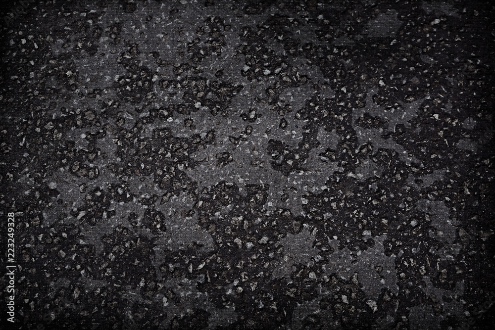 Obraz premium the dark gray asphalt texture background rocks interspersed with gravel