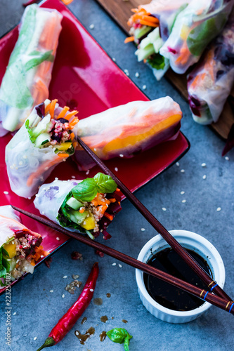 asian vietnamese spring roll with salad, vegetables and rice paper