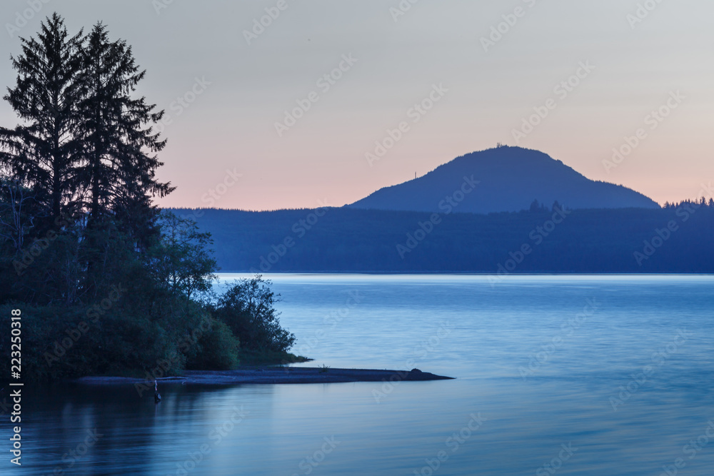 Scenic view of lake Crescent after sunset with its brilliant clear blue waters. Olympic national park, Washington State, USA.
