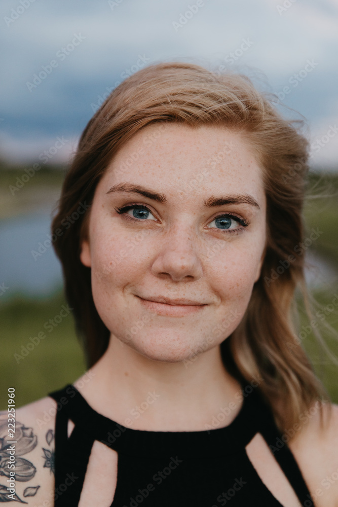 Cute Young Female Model with Short Hair and Freckles Modeling in a Bare Field Cute Young Female Model with Short Hair and Freckles Modeling in a Bare Field