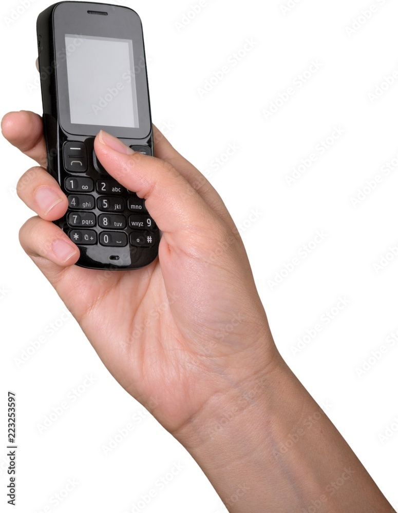 Closeup on Hand Using an Old Mobile Phone Closeup on Hand Using an Old Mobile Phone