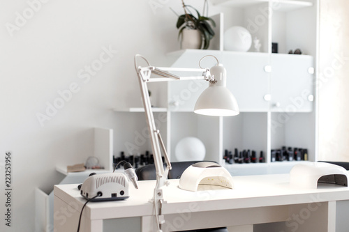 Nail care. Light studio for manicure with a tool
