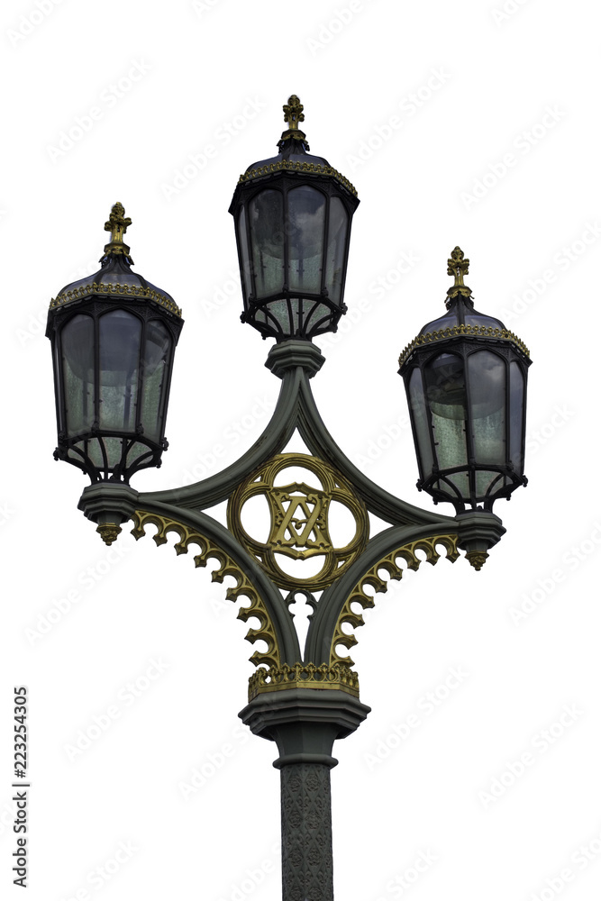 Isolated on a white background is a photograph of one of the old street lights from Westminster Bridge in London