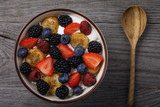 Useful breakfast of cottage cheese, sour cream and various berries with fruits. View from above