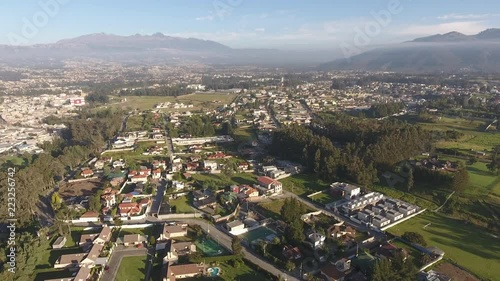 Aerial view of Sangolqui, Ecuador. In the Inter-Andean valley near Quito, Ecuador. With the Santa Clara Ravine. The football stadium is visible left. Pan to Ilalo Mountain. photo