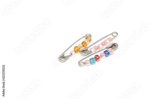 pin brooch with beads, isolated in white background
