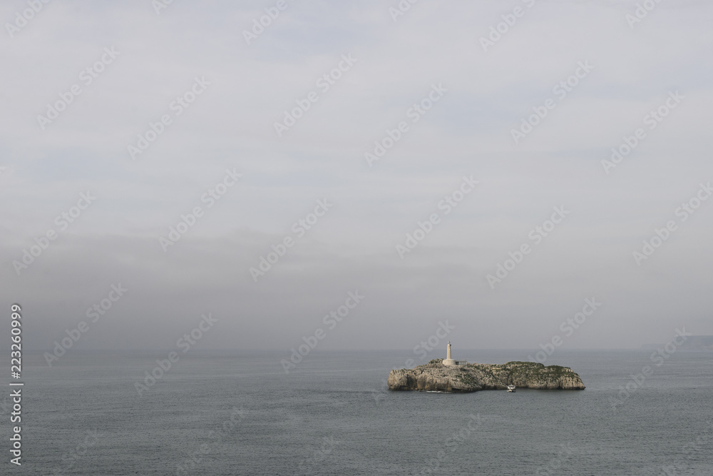 Panoramic view of Mouro Island and lighthouse in Santander, Spain