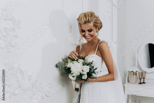 beautiful sexy young blond woman in bath with rose petals