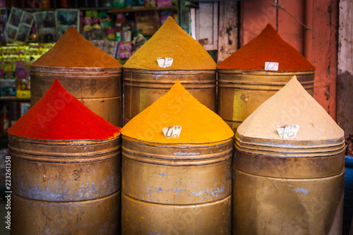 Colorful piles of powdered spices for sale in Marrakesh souq, Morocco photo