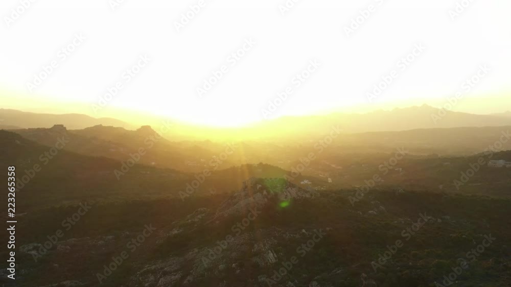 Video from above, amazing aerial view of a beautiful sunset behind some hills in Sardinia, Italy. Video from above, amazing aerial view of a beautiful sunset behind some hills in Sardinia, Italy.