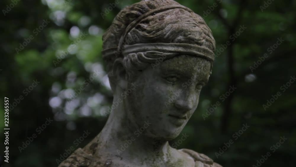 Grieving statue. Closeup as it starts to rain Grieving statue. Closeup as it starts to rain