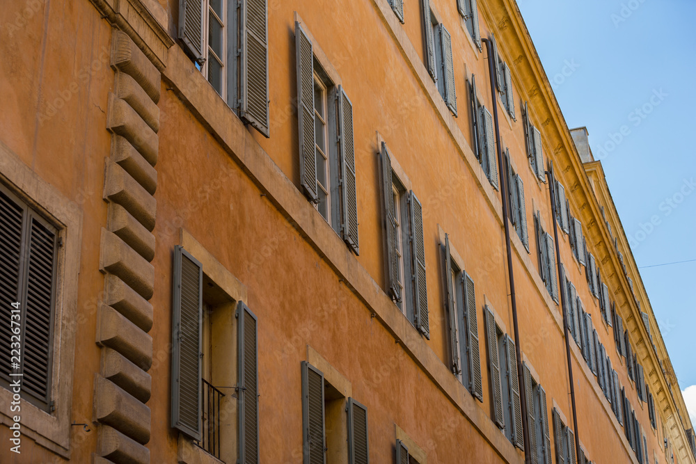 Typical shuttered windows on a building in Rome, Italy