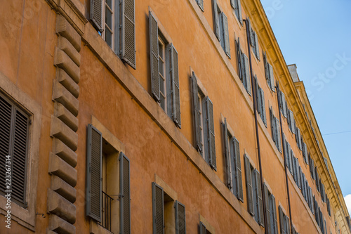 Typical shuttered windows on a building in Rome, Italy