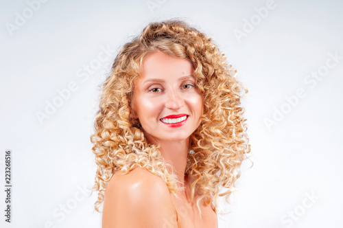 Beautiful woman with curly blonde hair.