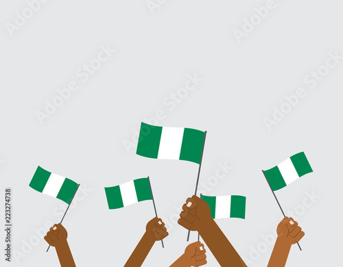 Vector illustration hands holding Nigeria flags isolated on background