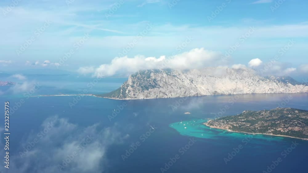 View from above, aerial view of the beautiful island of Tavolara bathed by a transparent and emerald sea, Sardinia, Italy. View from above, aerial view of the beautiful island of Tavolara bathed by a transparent and emerald sea, Sardinia, Italy.