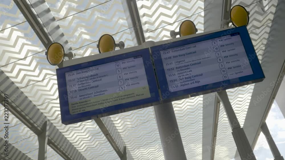 A sign or a board of the NS saying which trains are leaving from Gouda station to other stations like Amsterdam and Rotterdam.