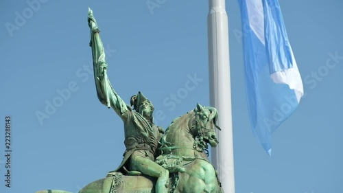Belgrano statue and Argentina flag waving photo