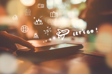 Travel vacation icons mixed screen on woman hand using smartphone to plan for long weekend.