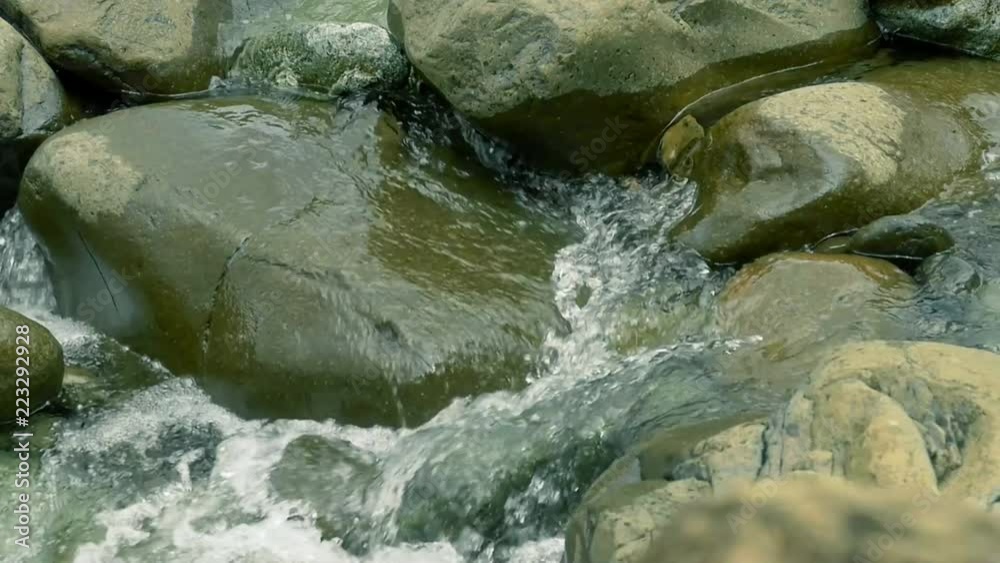 slow-mo of water cascading down stony creek in New Caledonia slow-mo of water cascading down stony creek in New Caledonia