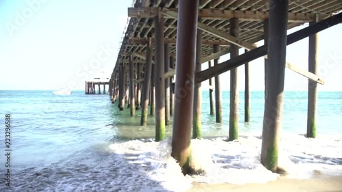 FHD footage : Waves in Malibu under the beach pier (slowmotion) photo