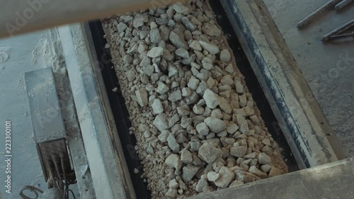 Industrial clinker manufacturing - raw materials on a machine rolling belt for manufacturing clinker (Cement) 4K footage