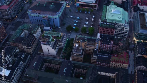 A aerial tilt from above central Stockholm Sweden at dusk. Focusing on Hötorg's square and the old city by afar. photo