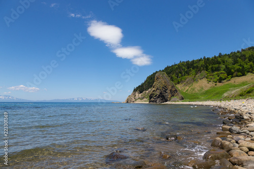 Cape Stolbchaty. Cape on the west coast of the island of Kunashir. It is composed of layers of basaltic lavas of the Mendeleyev volcano.