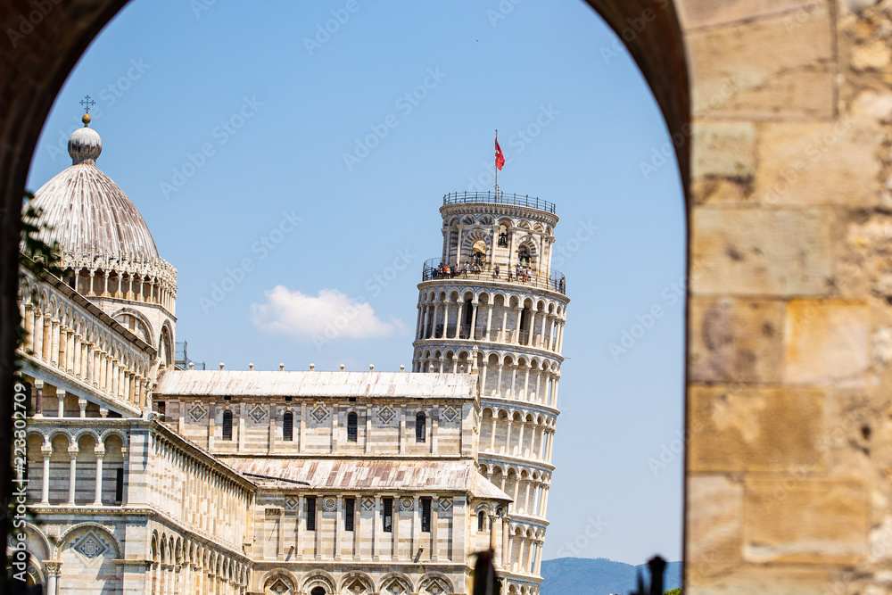 Leaning Pisa tower against the blue sky