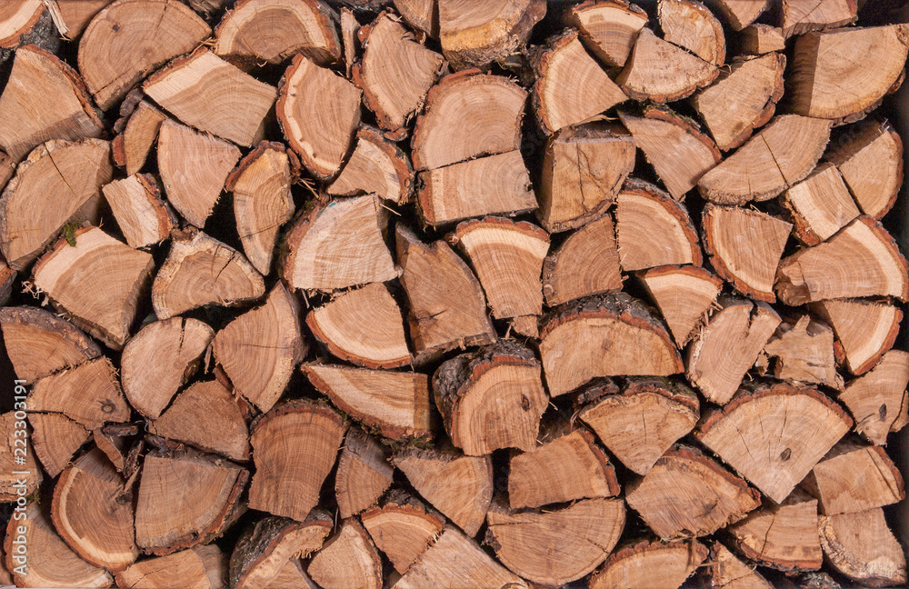 Wooden logs, beams, firewood. A lot of wood. Wooden log wooden background. Fuel. Harvesting firewood for the winter. Wooden logs, beams, firewood. A lot of wood. Wooden log wooden background. Fuel. Harvesting firewood for the winter.