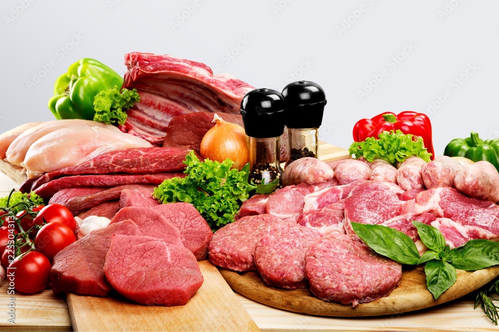 Fresh Raw Meat Background with vegetables Fresh Raw Meat Background with vegetables