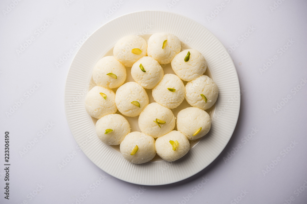 Indian Rasgulla or Rosogulla dessert/sweet served in a bowl. selective focus Indian Rasgulla or Rosogulla dessert/sweet served in a bowl. selective focus
