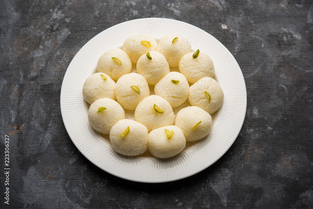Indian Rasgulla or Rosogulla dessert/sweet served in a bowl. selective focus Indian Rasgulla or Rosogulla dessert/sweet served in a bowl. selective focus