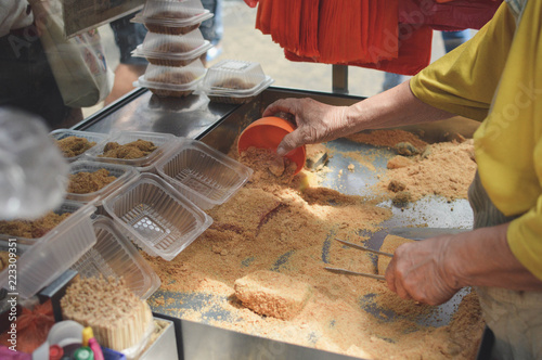 Photography Delicious sweet mochi with peanuts sold at a street stall in Kuala Lumpur, Malay
