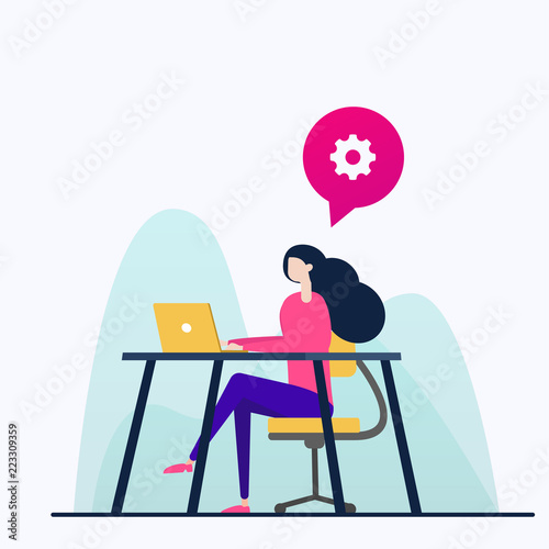 woman sitting at the table and working