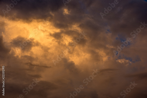 Golden clouds in the sky at sunset