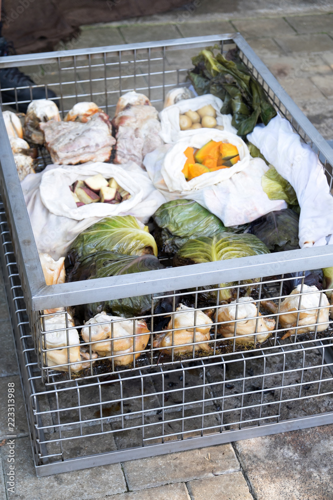 Hangi food meat and vegetables cooked in a traditional Maori earth