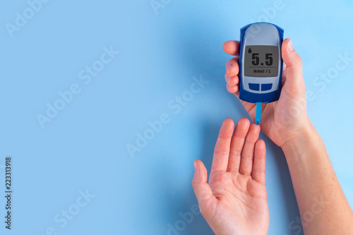 The diabetic measures the level of glucose in the blood. Diabetes concept. Copy space. Diabetes photo