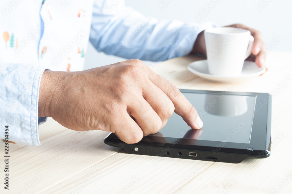 Close up man hand on tablet screen Close up man hand on tablet screen