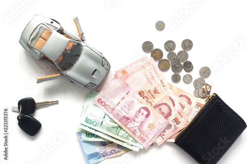 Car loan or financial with Thai banknotes currency, top view on white background