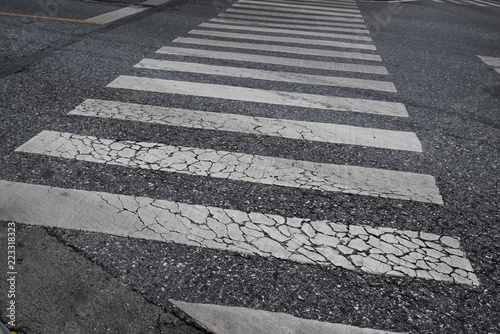 Cracked pedestrian crossing © wachiwit
