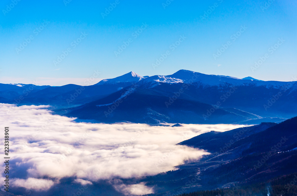 Beautiful mountain landscape over the clouds
