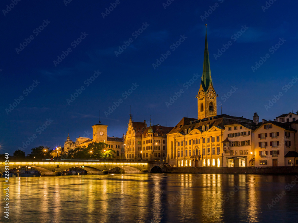Frauenmunster Abbey and Stadthaus in Zurich at night,  Switzerland