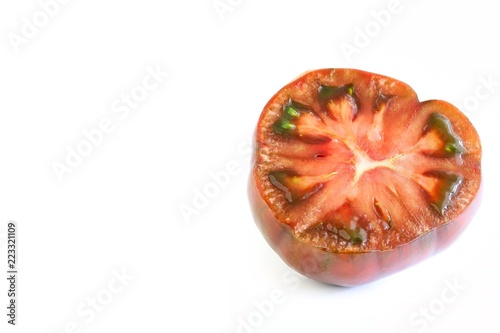 Fresh Black Russian Tomato Cut In Half On White Background