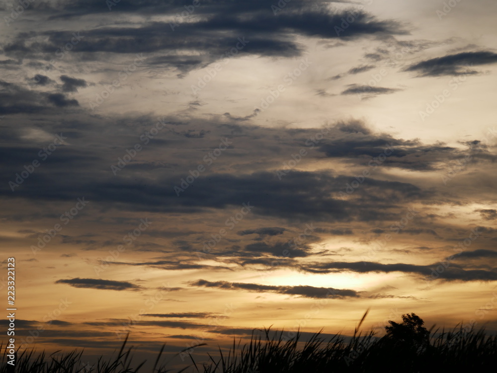 Take a photo at sunset.The sky is orange.Most of the sky is orange, but there are other colors.