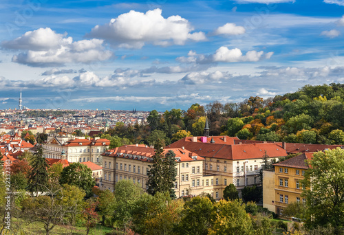 Bright and beautiful autumn view on Prague Castle, Old town and city center with old red roofs, Prague, Czech Republic