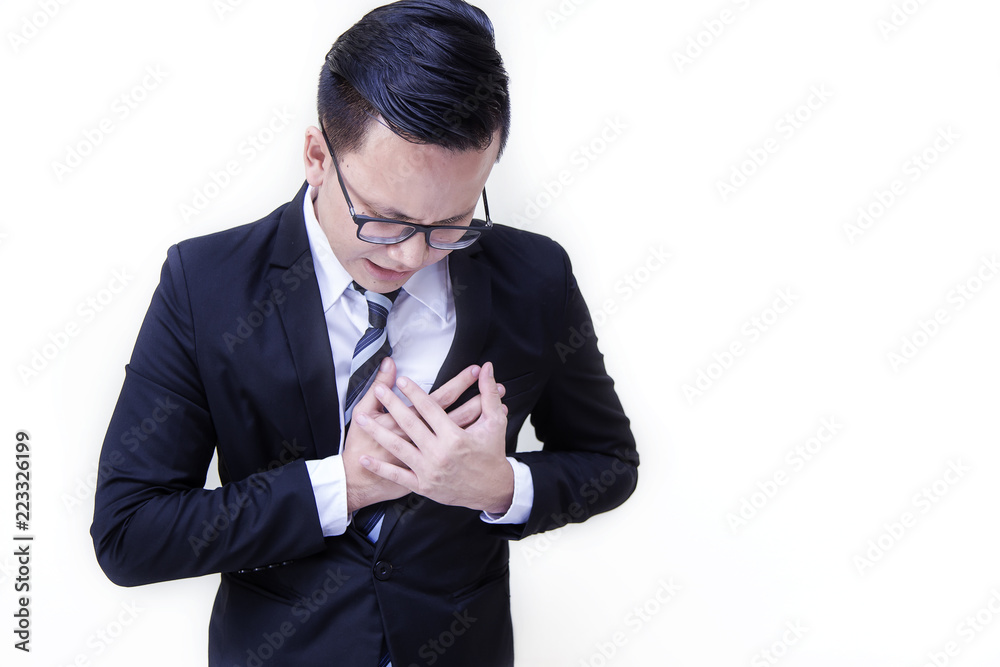 A portrait of Young Handsome asian businessman in black suit very tried after work having heart attack on white background. Healthy people Concept. A portrait of Young Handsome asian businessman in black suit very tried after work having heart attack on white background. Healthy people Concept.