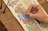 Close-up of hand of medieval manuscript scribe - calligraphy