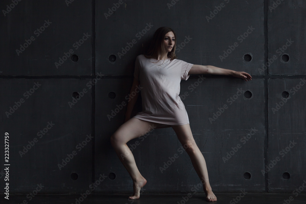 young beautiful woman professional dancer dancing during a rehearsal in a dance studio, modern dramatic style, experimental dance young beautiful woman professional dancer dancing during a rehearsal in a dance studio, modern dramatic style, experimental dance